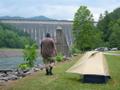 photograph of myself and a one-man tent in front of Fontana Dam, NC, US, in 2003.